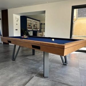 Osmoz 2m40 chene massif, piétement Gris Graphite et retour de billes par goulottes. Drap Bleu marine